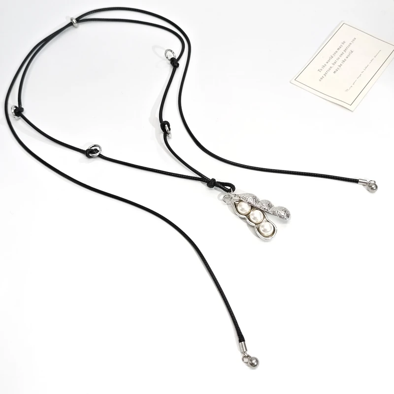 铜合金皮质项链 07337休闲气质设计感抽拉长款豆荚白珠黑绳项链