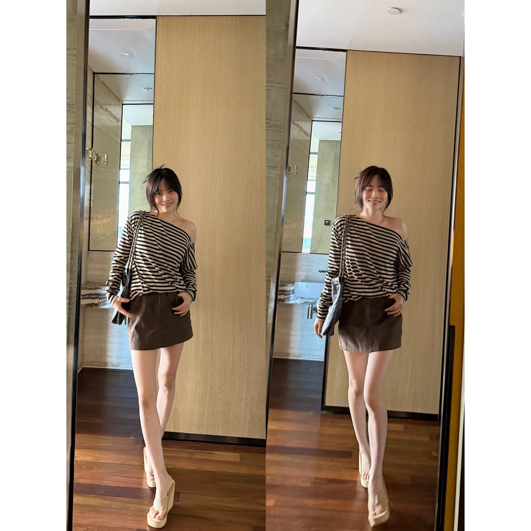 井迪儿【佳酿】50%PU复古风咖色仿绒弧形腰自带安全裤半身短裙