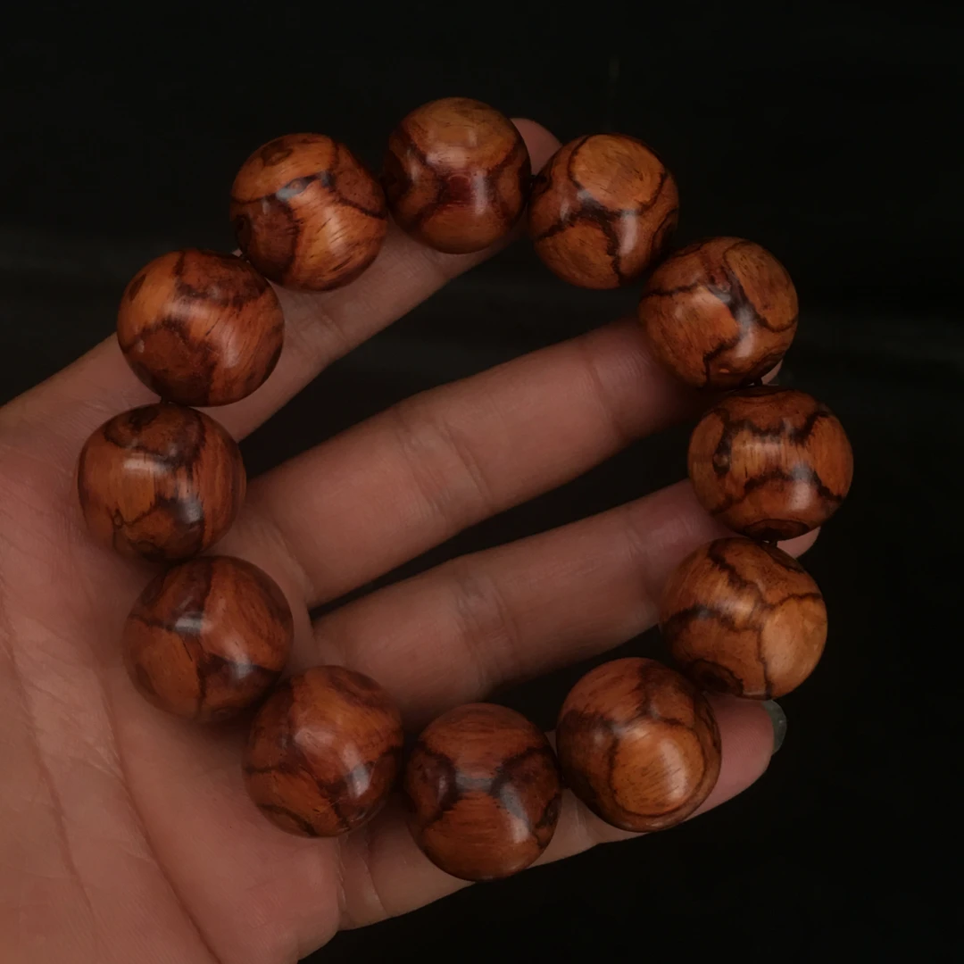 s2号2.0海黄对眼X纹鬼脸手串文玩好物，克重：42.4克