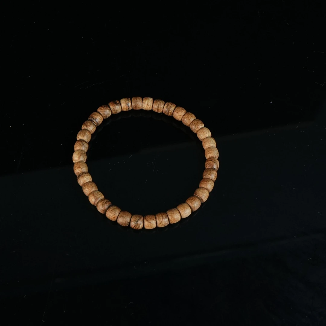 4208 巴布亚沉香粗纹8分沉老型珠 0.65x0.55cm 3.71g