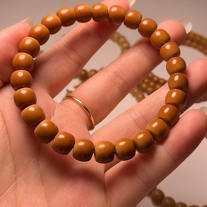 怎***说橄榄核吊坠核尖极限弧
