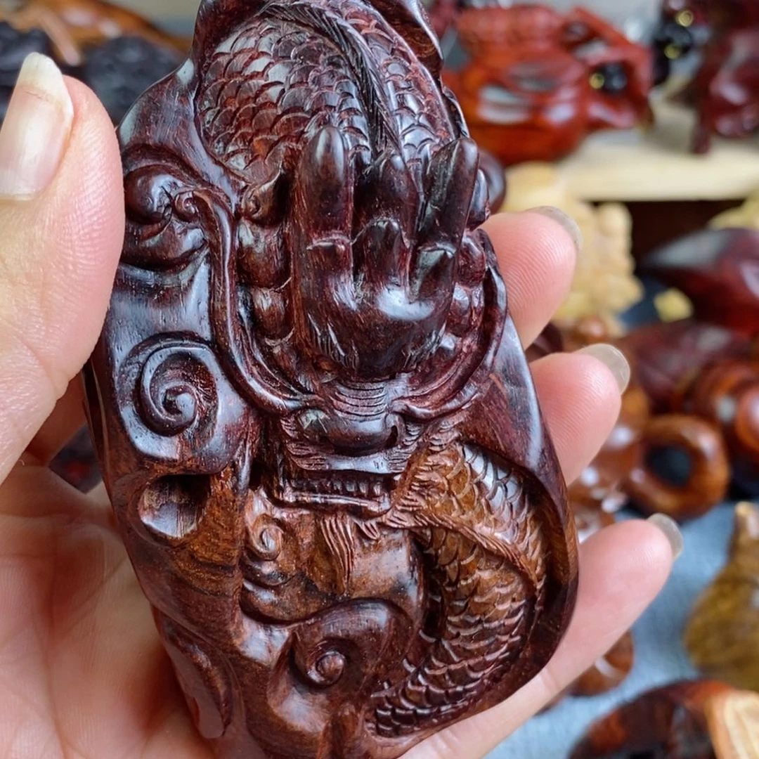 木步****g黄花梨紫油梨龙牌手把件