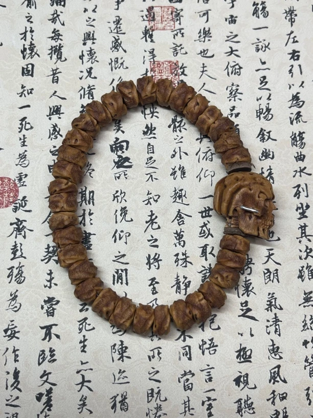 纯手工雕刻桃核无相手串搭配精工镶嵌骷髅