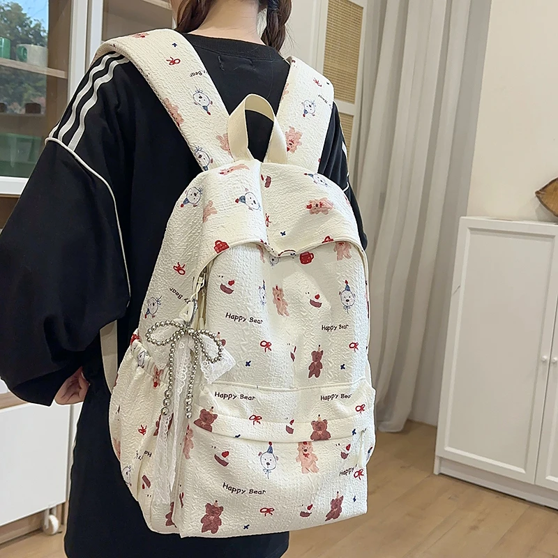 双肩包女2025新款可爱少女印花书包大学生轻便百搭高颜值小众背包