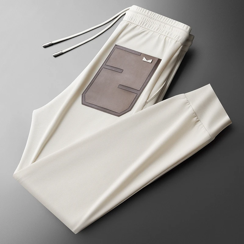 高级感夏季薄款冰感丝滑休闲裤男修身小直筒时尚侧边织带男士长裤