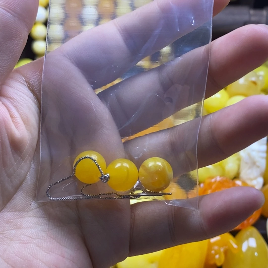 杨***宿非金属树脂一对耳线和一颗12的老蜡珠子