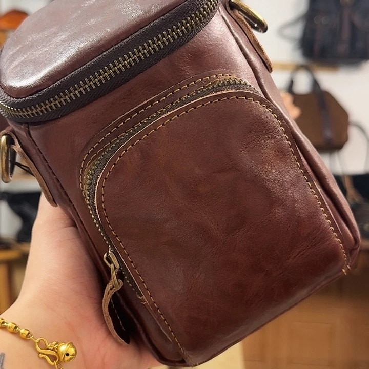 乔***治黄牛皮（革）头层牛皮手机包咖啡