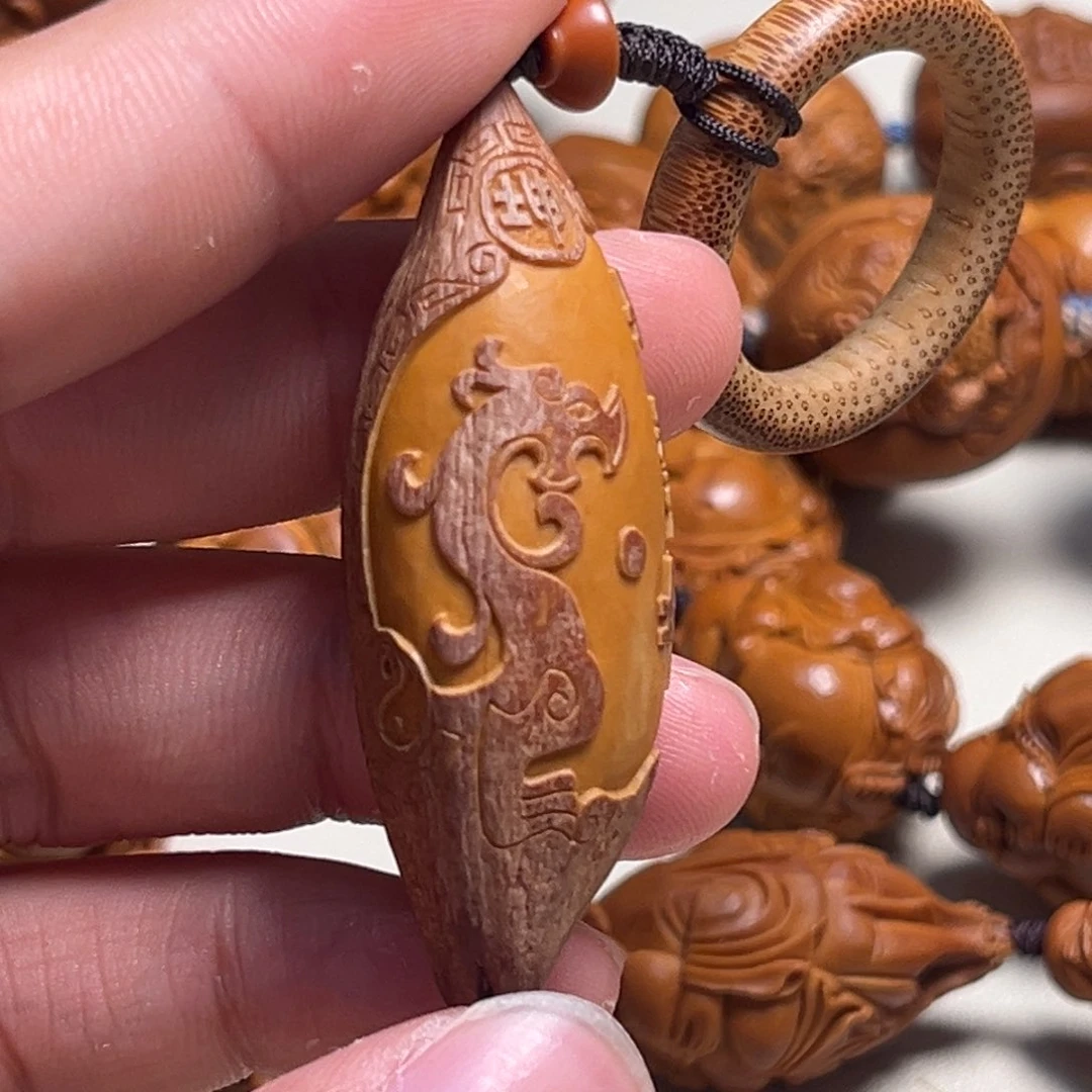 橄榄核吊坠1.9紫皮地势坤