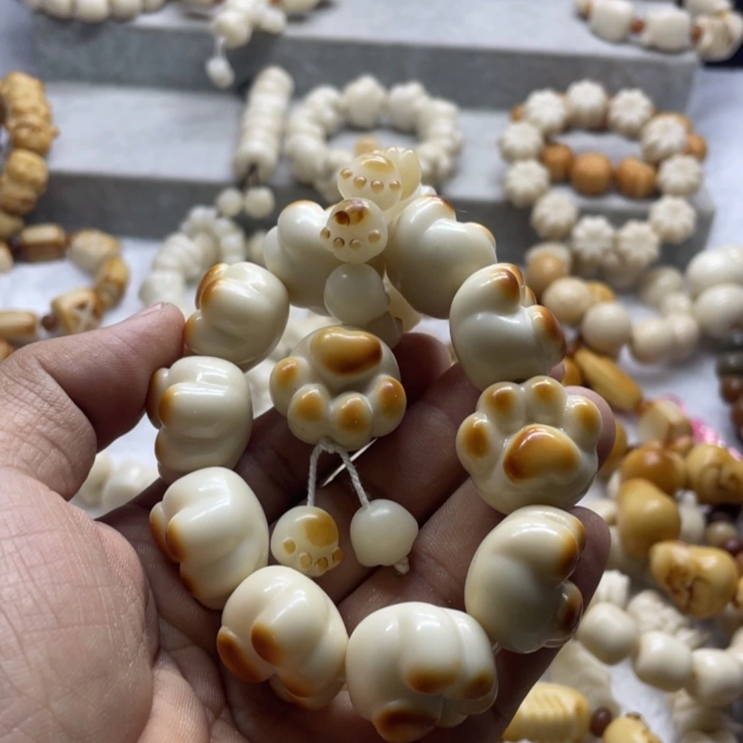 蕊***吊坠菩提根/象牙果全品象牙果烤色狗爪卡23/25手串