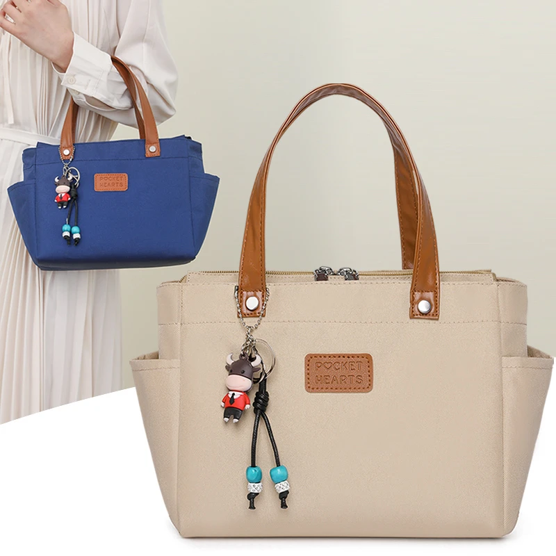 韩系新款手提女包外出通勤高档休闲森系防水布包妈妈包饭盒便当包