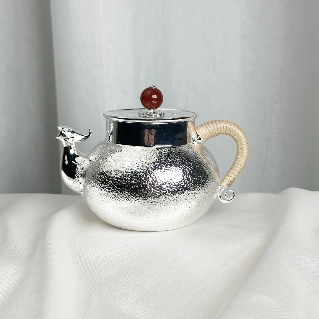 -手工锻打雪花纹兽嘴泡茶壶999银
