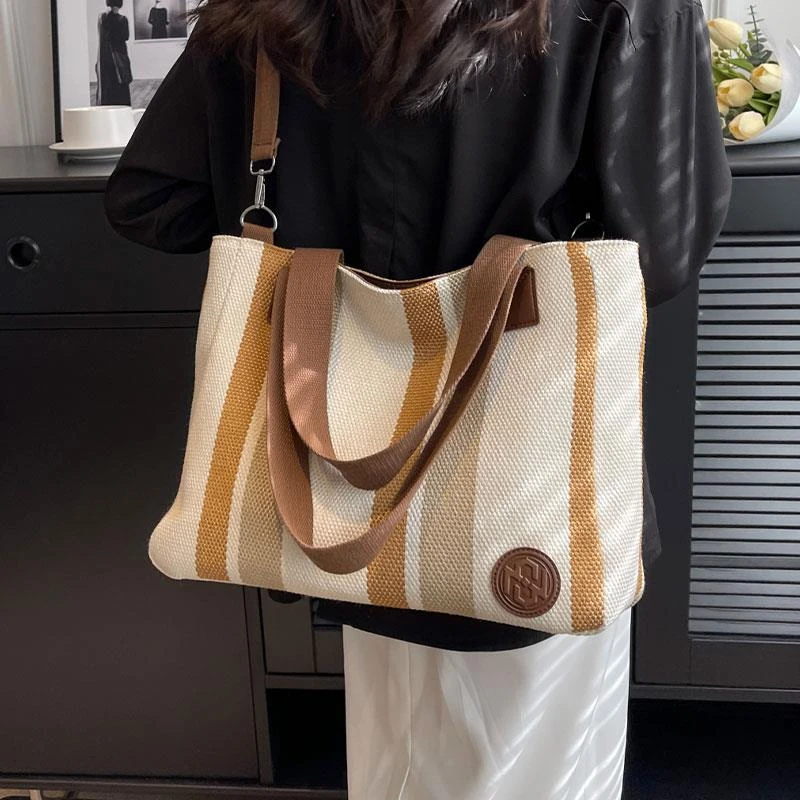 外出通勤包女大容量包包2024新款休闲大学生上课包帆布单肩托特包