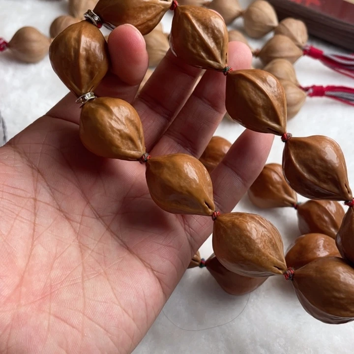 吉***喆橄榄核吊坠梅林老料