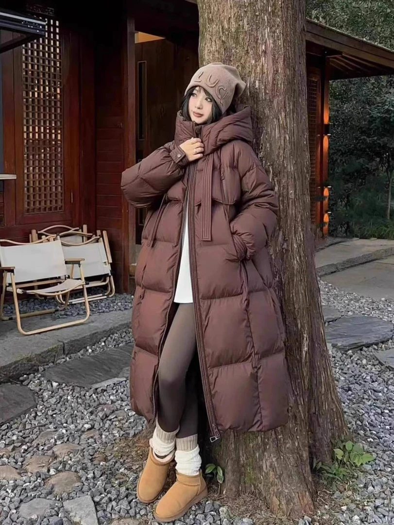 韩版长款过膝连帽羽绒服女飘带白鸭绒2024冬季新款保暖面包服外套