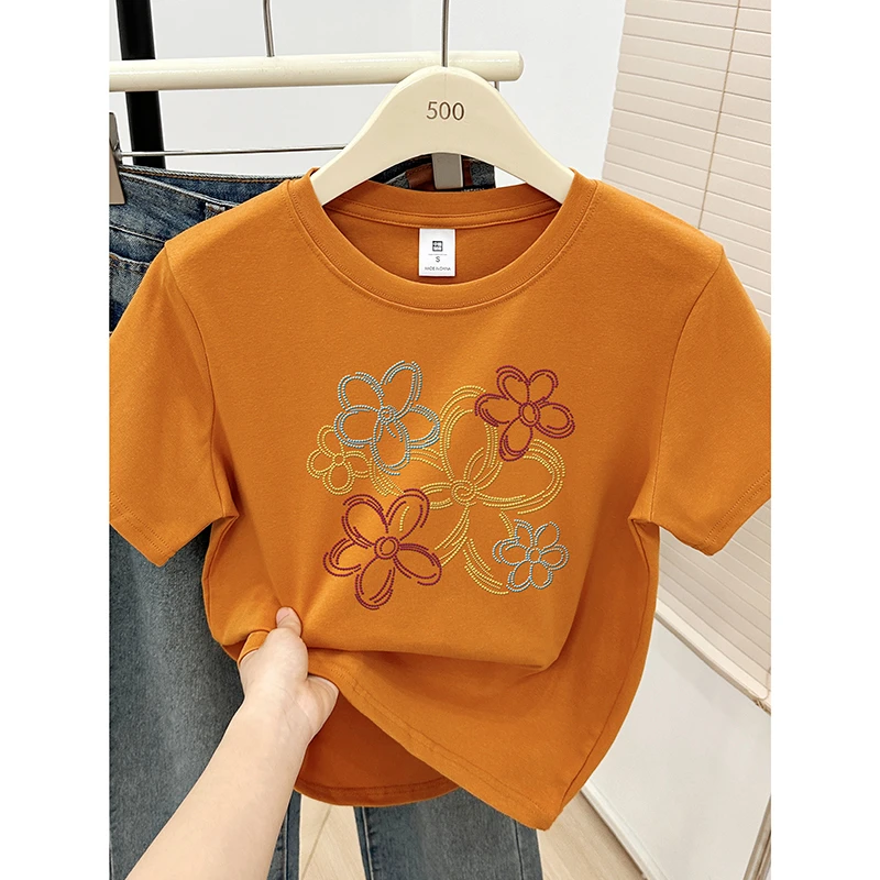南瓜色圆领短袖T恤女夏装2025新款线条花朵印花今年流行正肩上衣