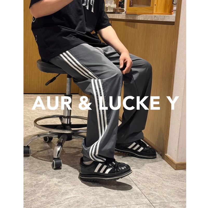 【黑标复刻】挺括感激光穿孔三条杠长裤！宽松直筒男女同款！DK366