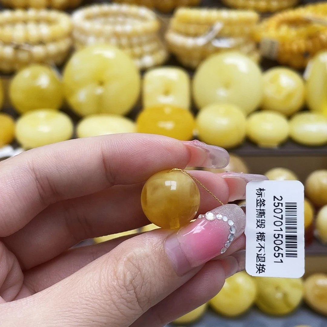 裸石琥珀未镶嵌15.3mm黄妖溶洞圆珠瑕