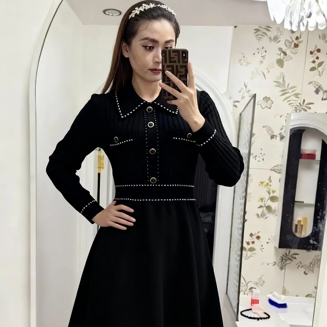 法式小香风黑色针织连衣裙女2025秋冬季新款女神范高腰A字毛衣裙