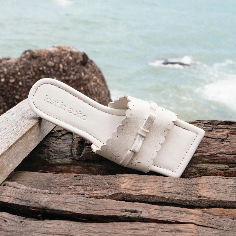 lost in echo2025春夏新款度假布洛克手工镂空轻便薄底平底凉拖鞋