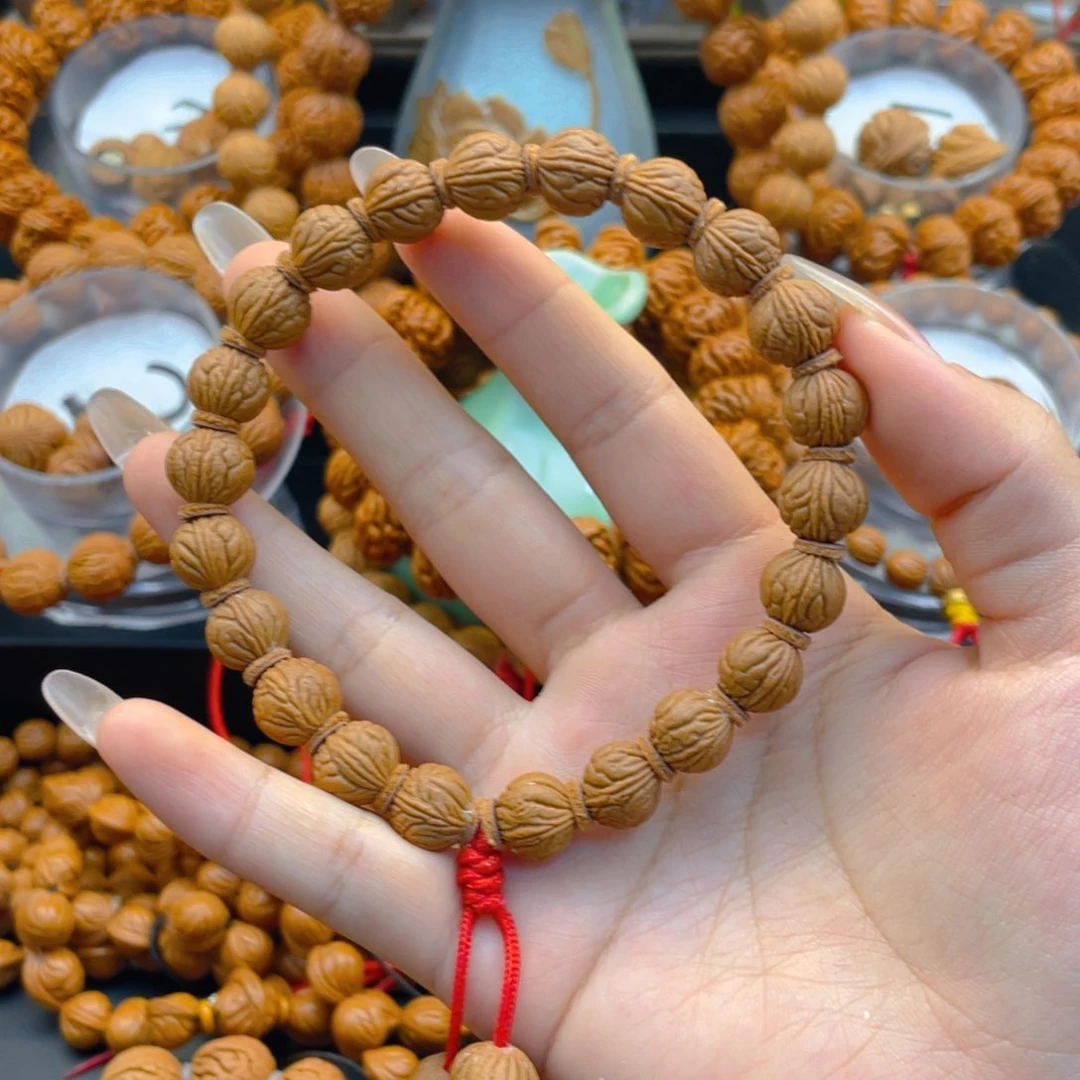 勾***子桃核手串杜杜杜杜杜