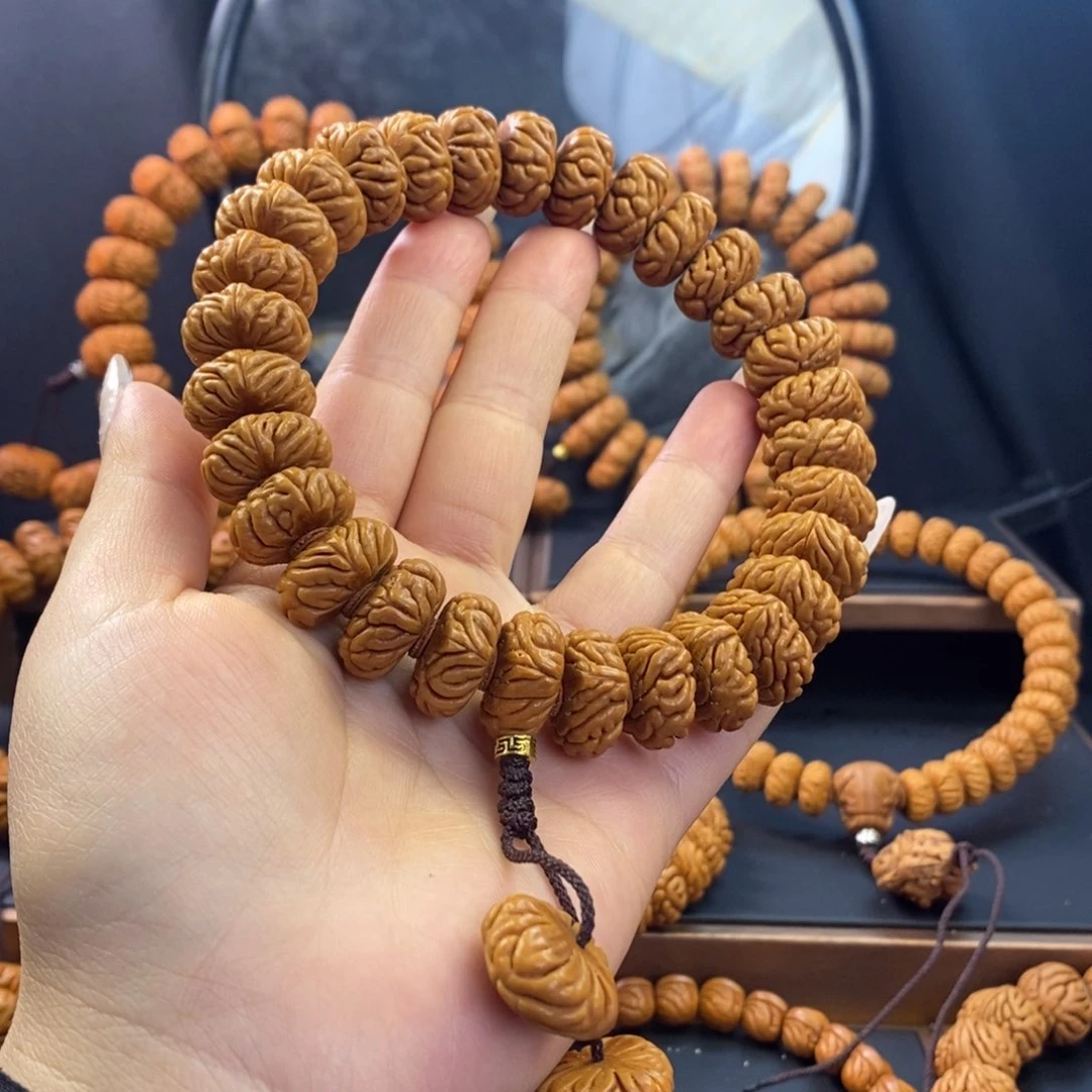 桃核手串达****N龙纹桃核祥云