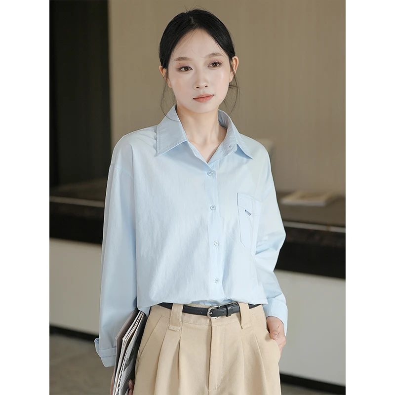 浅蓝色简约休闲衬衫女2025春季新款后背纽扣宽松叠穿设计感上衣潮