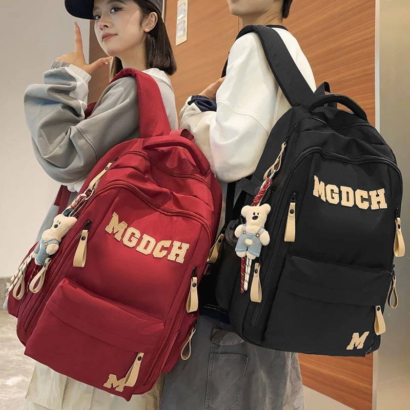 减负护脊双肩包女大容量学生书包男大学生情侣背包休闲旅行双肩背