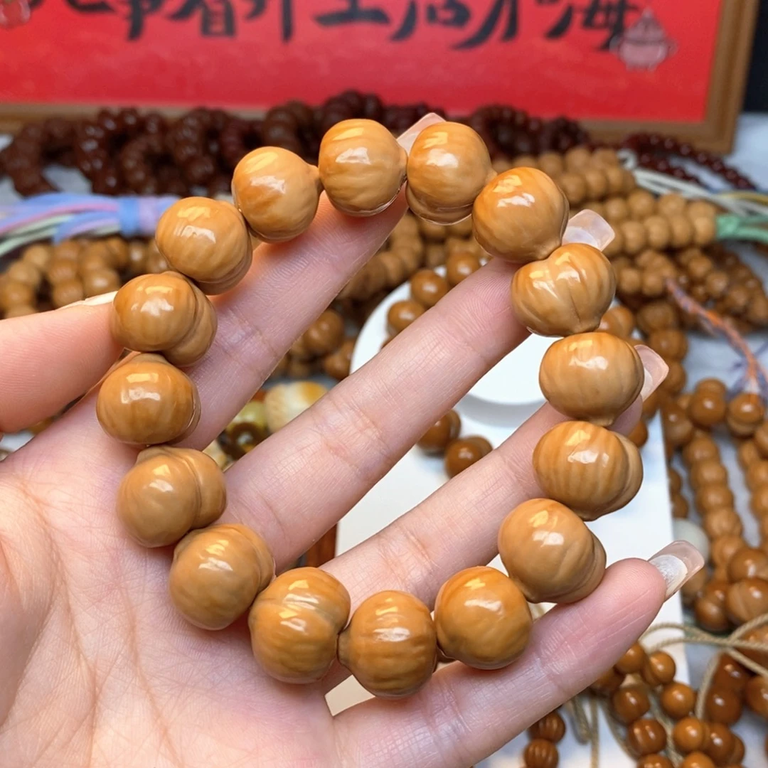 慧***慧吊坠猴头核桃二等肌理屁桃手串