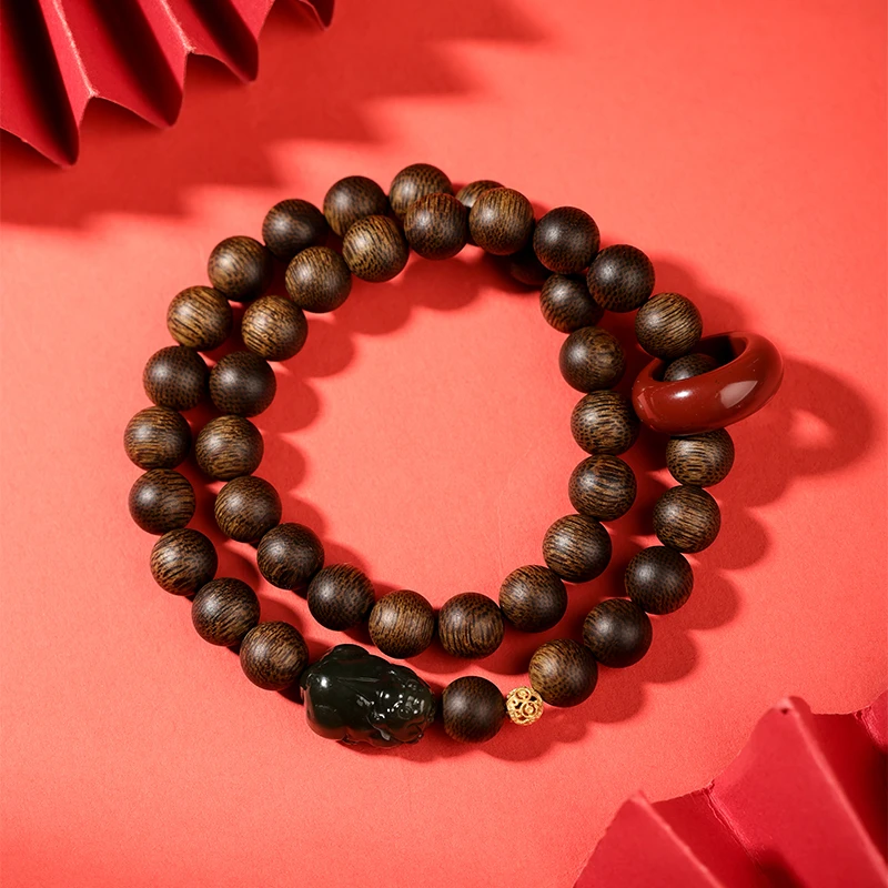 沉香【原木沉香】沉水越南芽庄黄棋楠玉化料06mm两圈设计款貔貅抱球