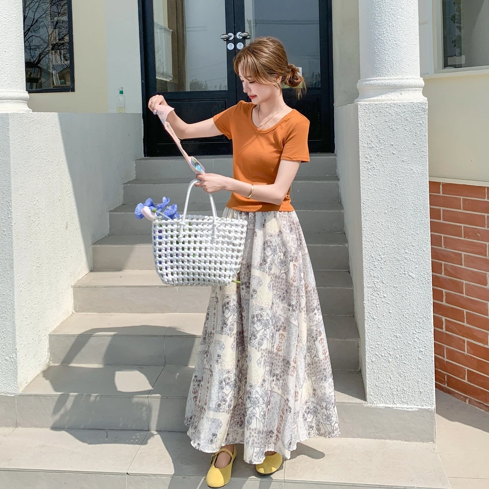 高级小众不撞款套装裙女夏季2025新款南瓜色T恤碎花半身裙两件套