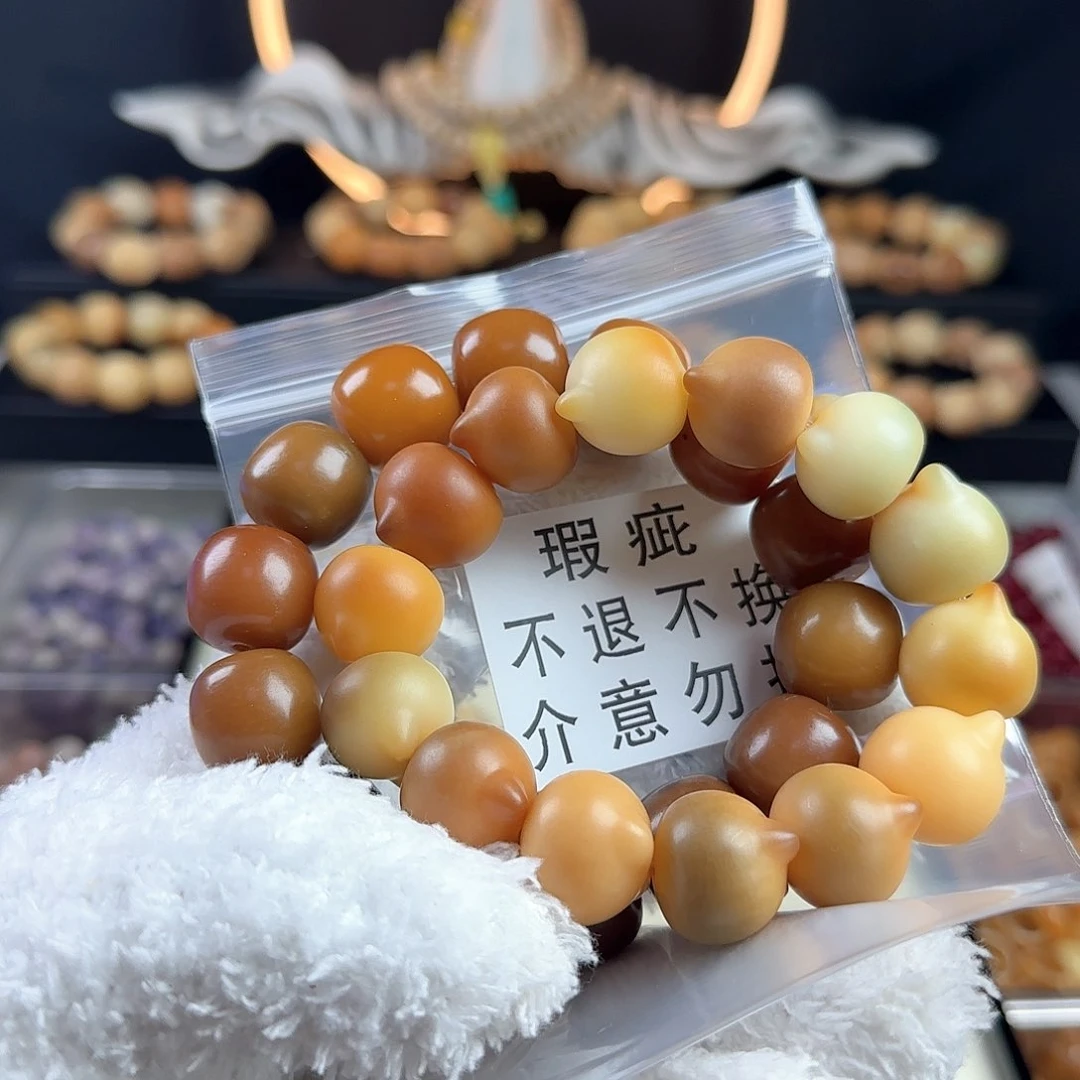 菩提根/象牙果手串一****年瑕疵猫头手串一条和瑕疵桶珠一条