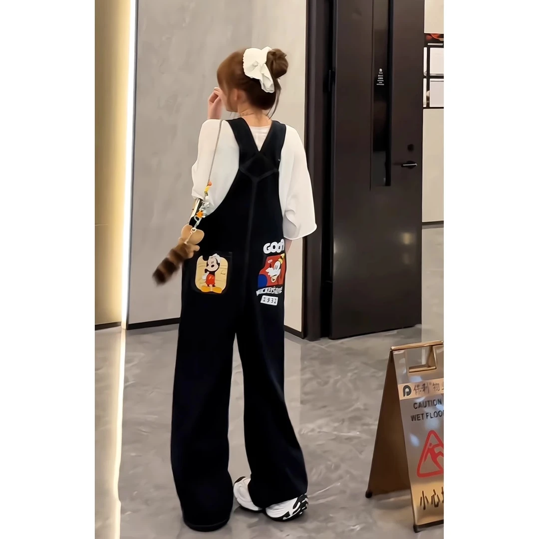 韩系减龄卡通米老鼠印花牛仔背带裤女2025黑色遮肉复古显高连体裤