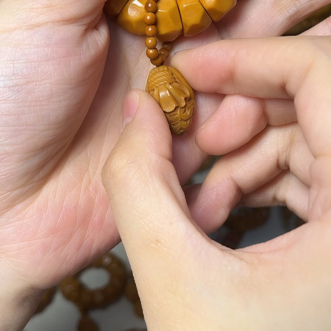 張***甫非金属木质天然钱袋子