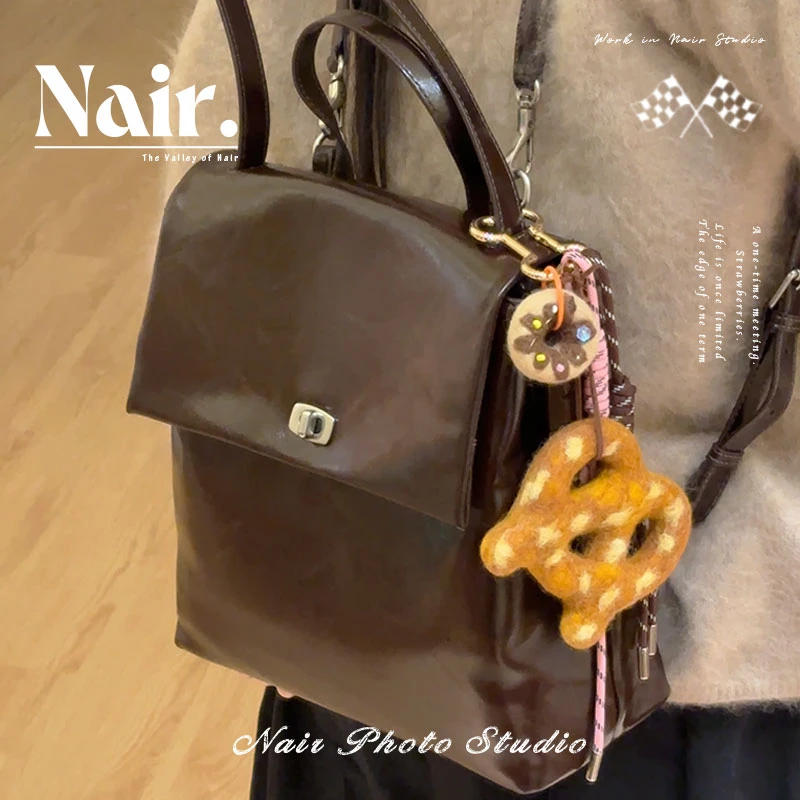 古莉奈尔巧克力盖子双肩包高级质感纹理秋冬新款百搭时尚通勤包