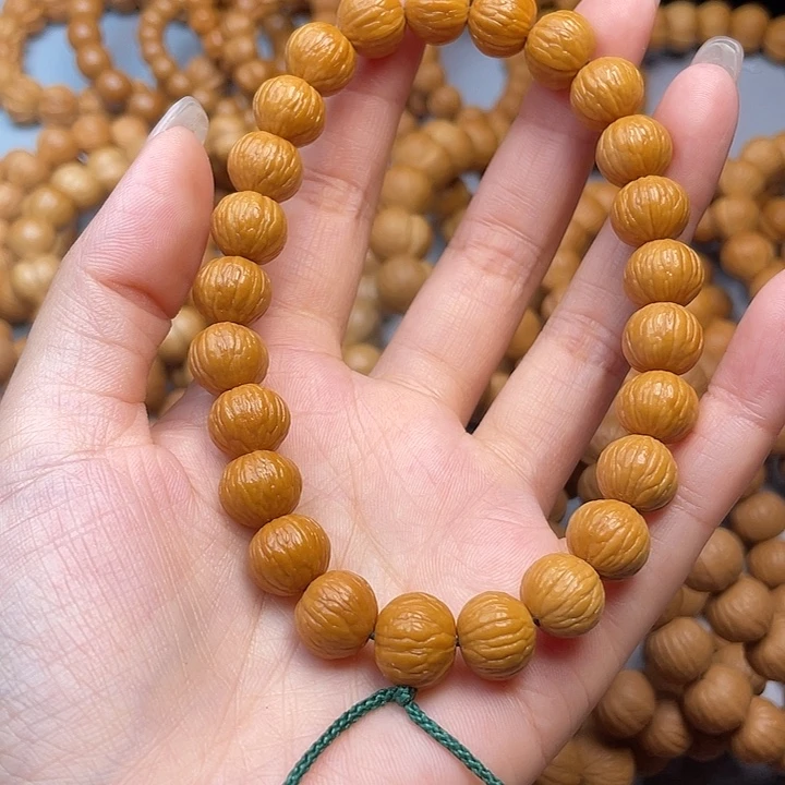 猴头核桃手串榴***?凤羽