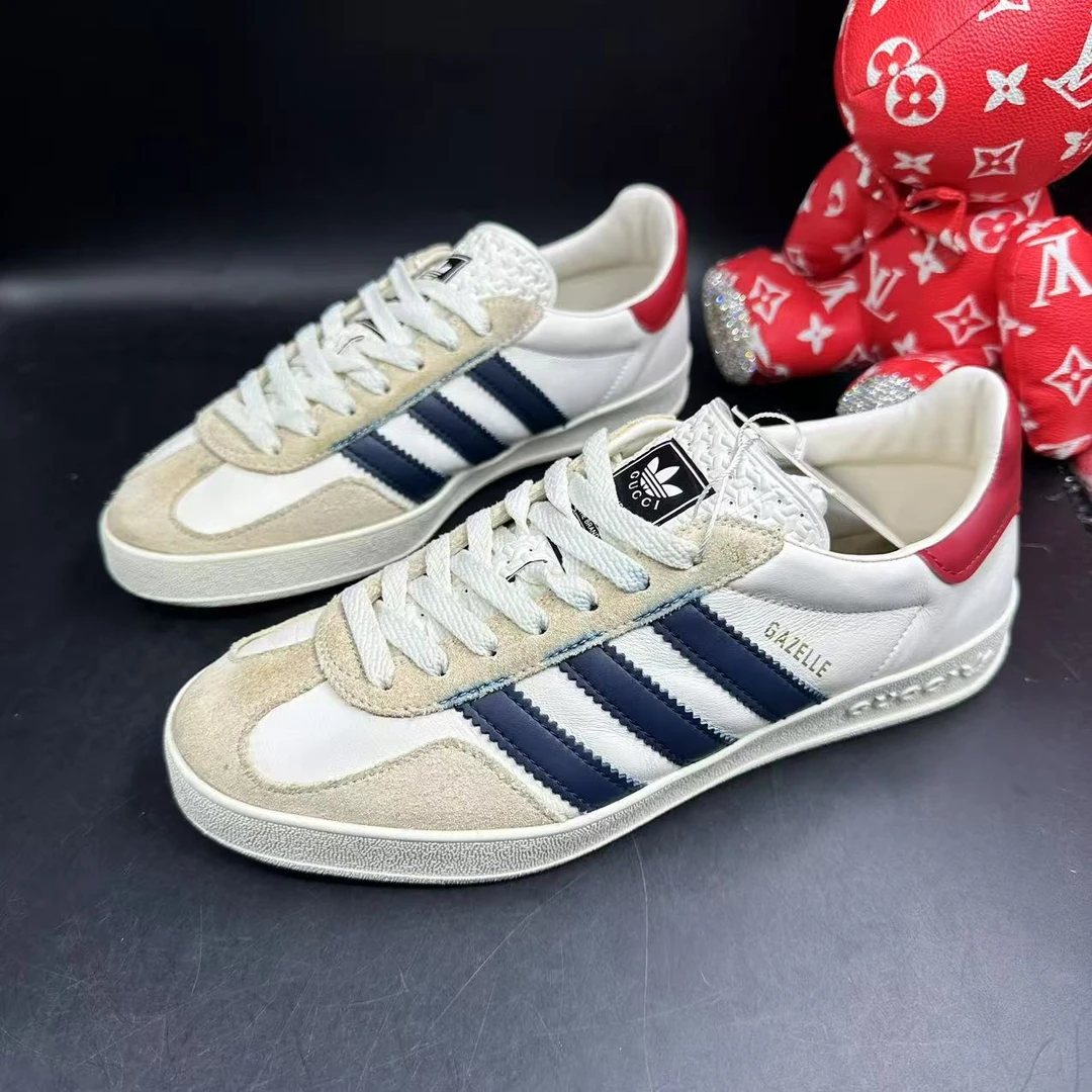 95新 GUCCI/古驰 男士蓝白条纹三叶草印花德训鞋38.5欧码 ddm2525