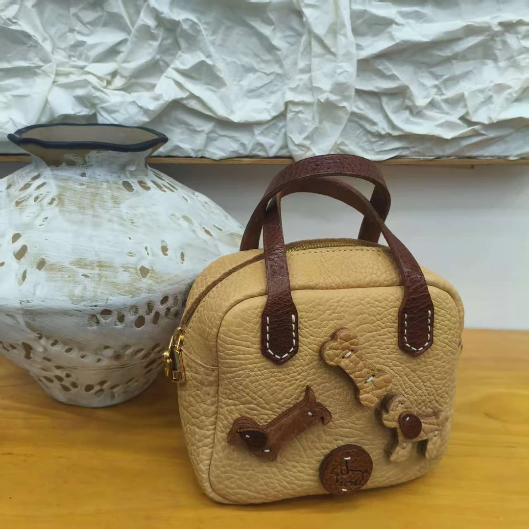 原生原物治愈系头层牛皮纯手工原色狗狗保龄球包