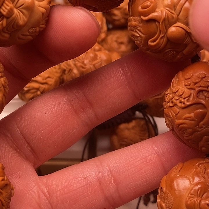 金***娃橄榄核吊坠橄榄核