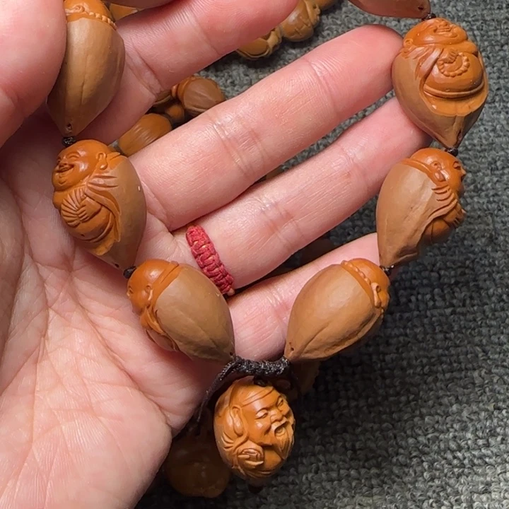 简***点吊坠橄榄核包衣财迷