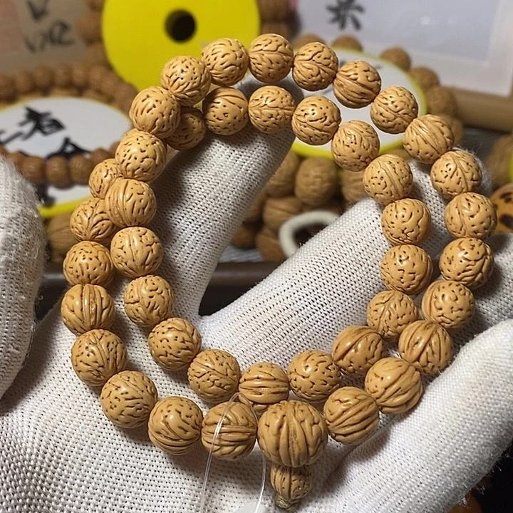 休***工桃核手串顺顺利利500。  68