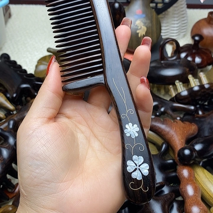 用***9紫光檀插尺顺发梳