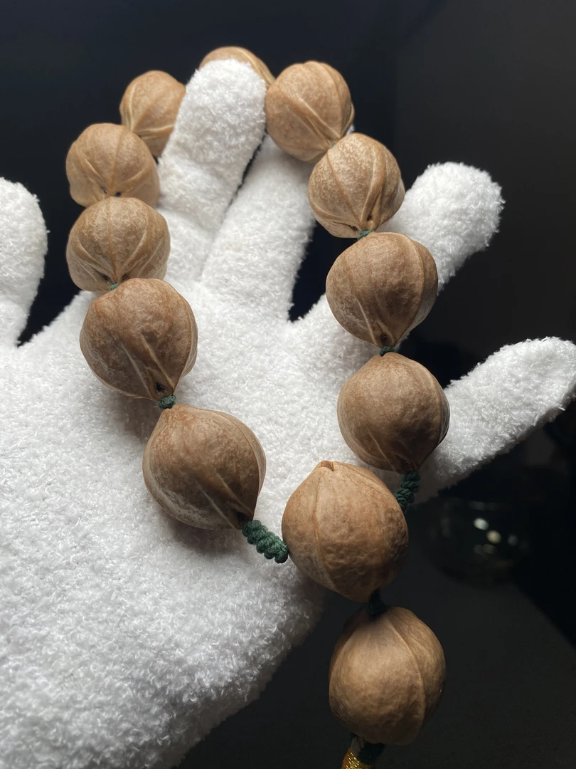 老料2.3饱满三花铁核+2.55四花铁核坠珠橄榄核手串