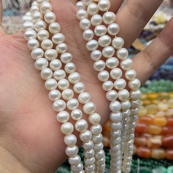 玛瑙/玉髓未镶嵌珠宝半成品一条7mm左右椭圆珍珠有生长纹