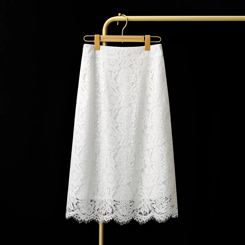 温柔风白色蕾丝a字半身裙夏季2025新款镂空钩花设计感高腰直筒裙