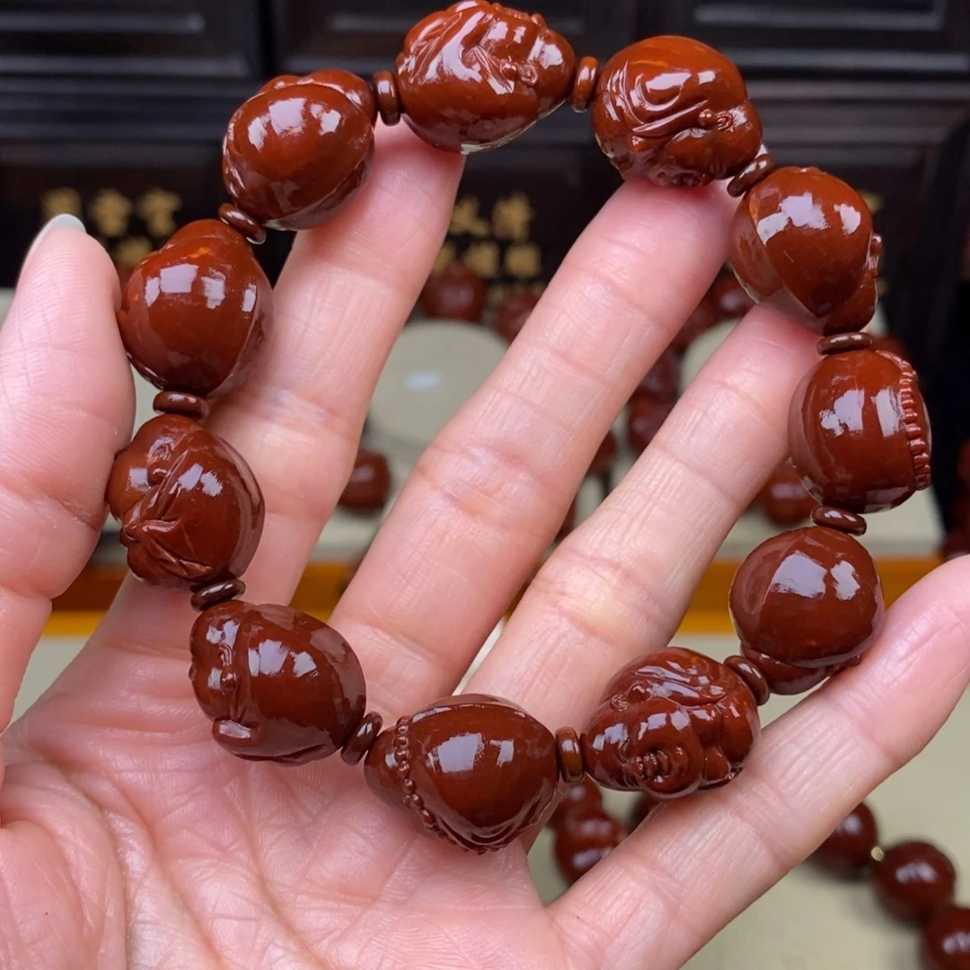 斯***哥橄榄核吊坠小弥勒