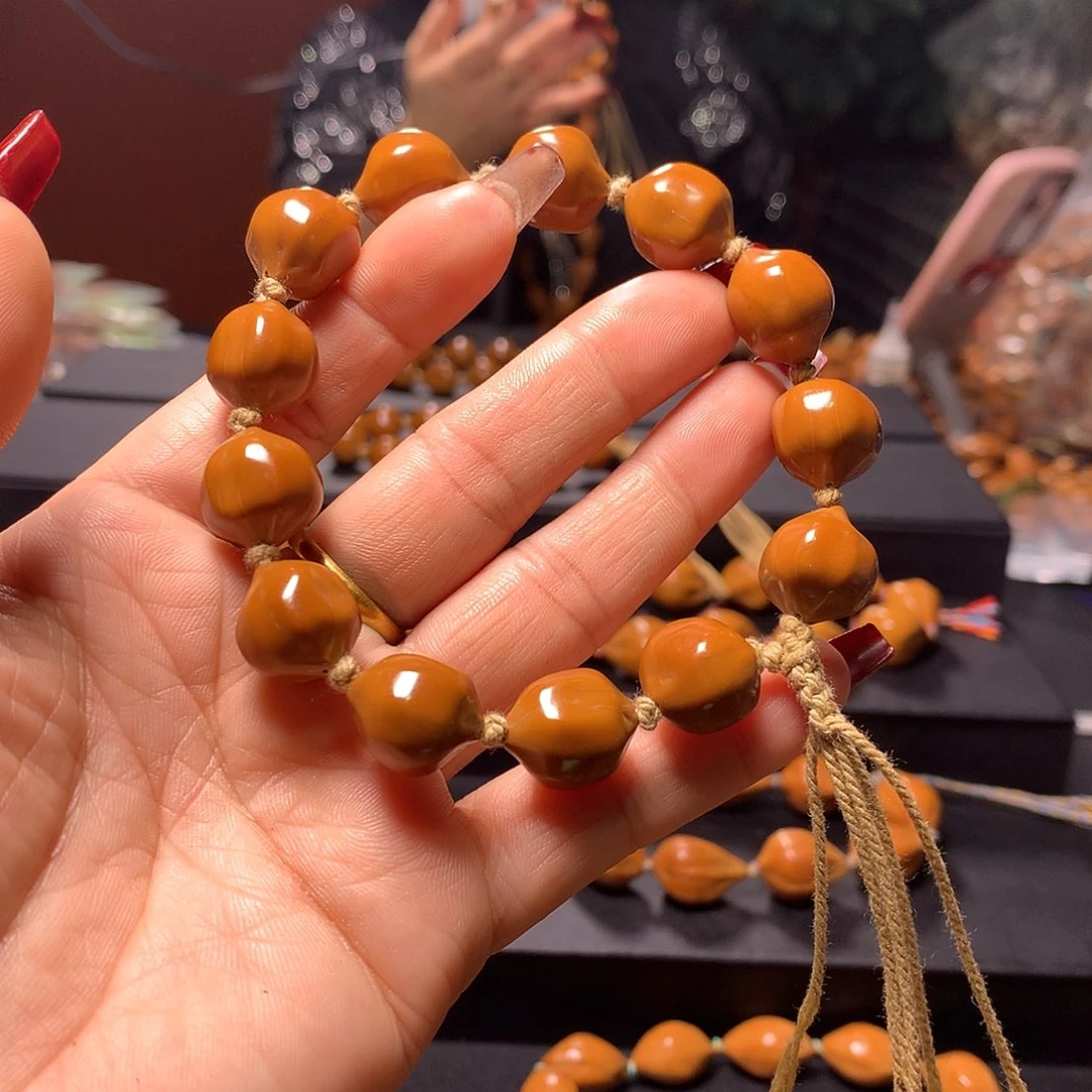 橄榄核手串/手链听***人三花手串