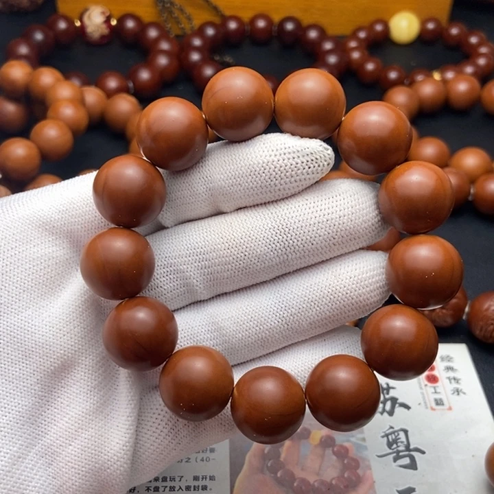 呆***聊橄榄核手串/手链1.65鸡血红铁核不同轴