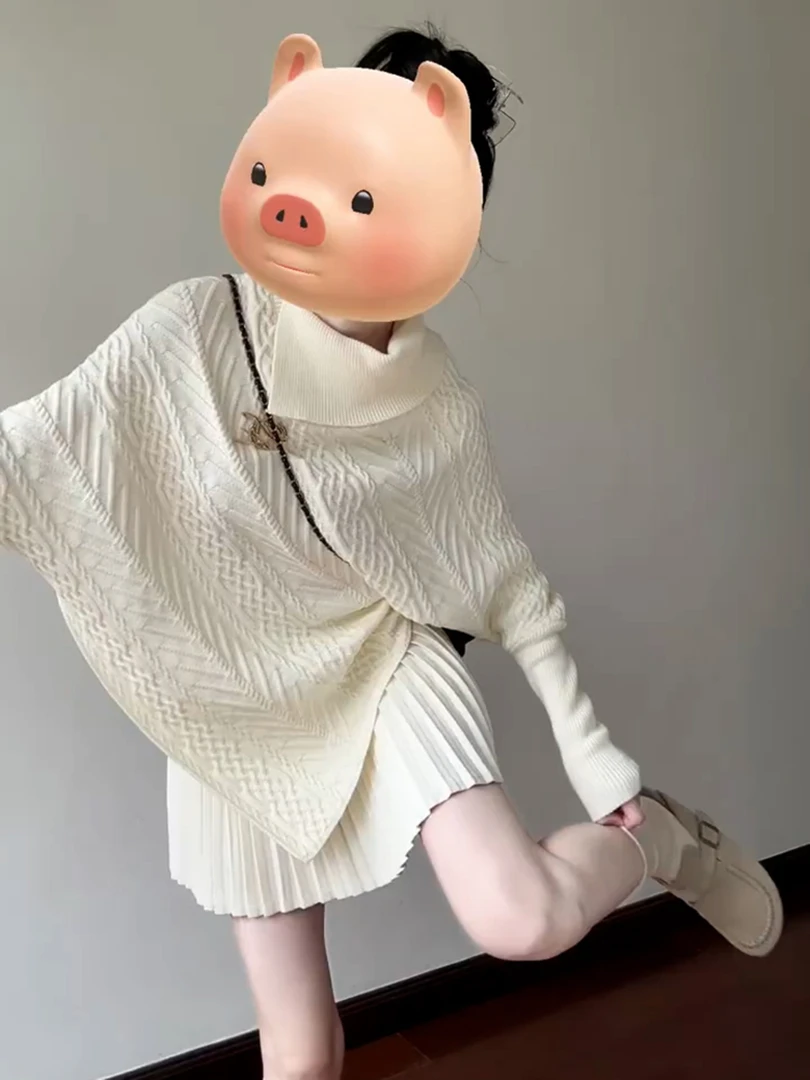今年流行漂亮复古软糯针织衫高级感超好看绝美白色不规则毛衣女秋