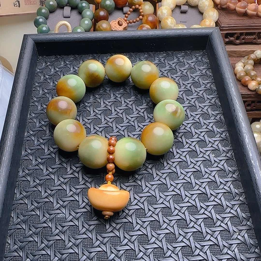 曹***、吊坠菩提根/象牙果