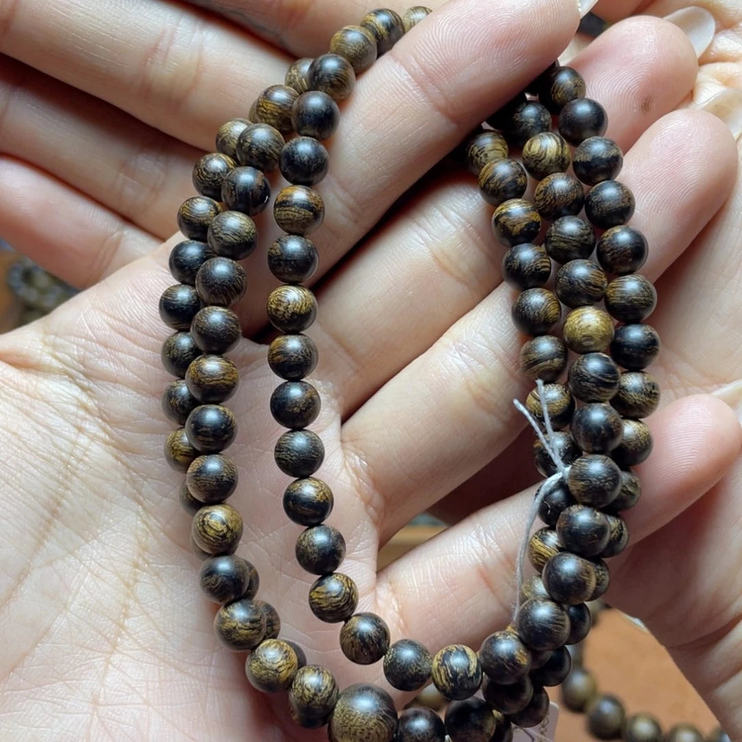 沉香手串会*越南芽庄红土白奇楠0.6虎皮留疤圆珠沉水级
